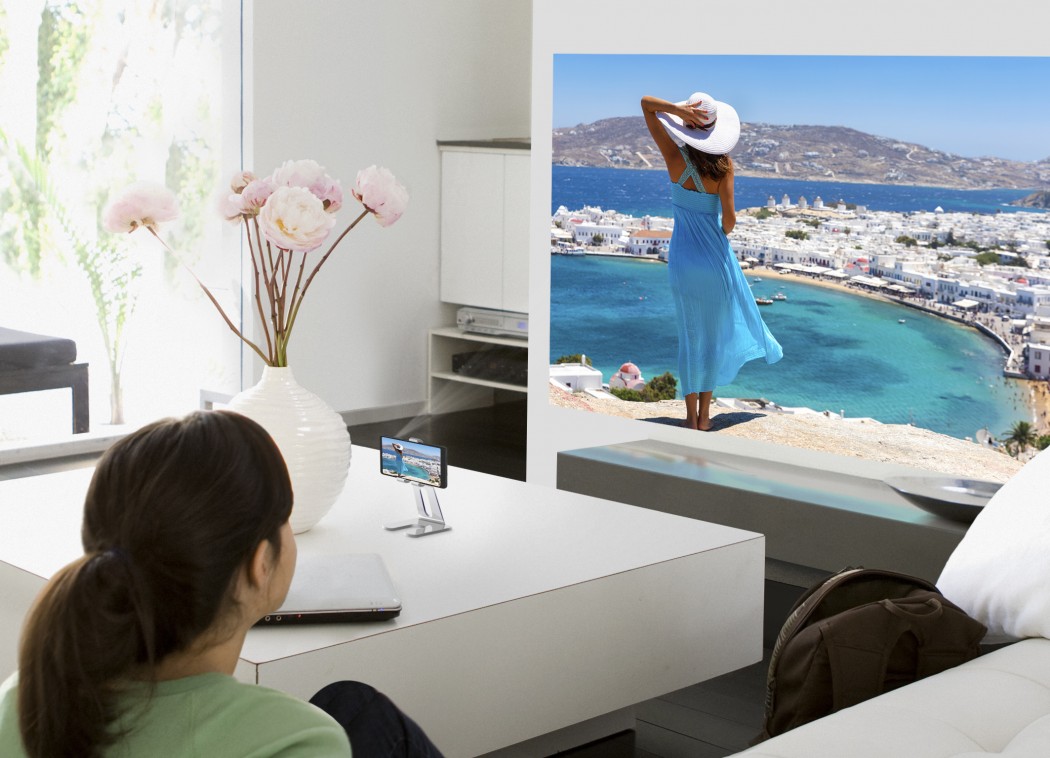 Teenage girl watching television in living room