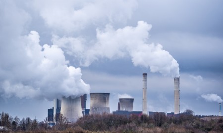 A wide angle shot of white smoke coming out of the nuclear plants