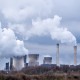 A wide angle shot of white smoke coming out of the nuclear plants